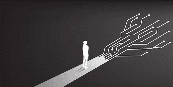 person walking on a road with different paths ahead of them